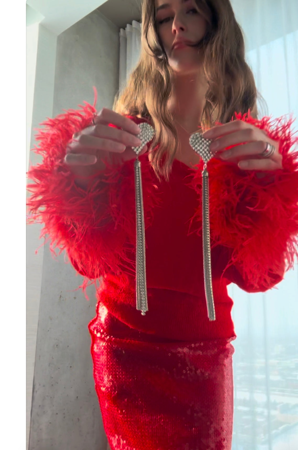 Orecchini con nappe a cuore di cristallo