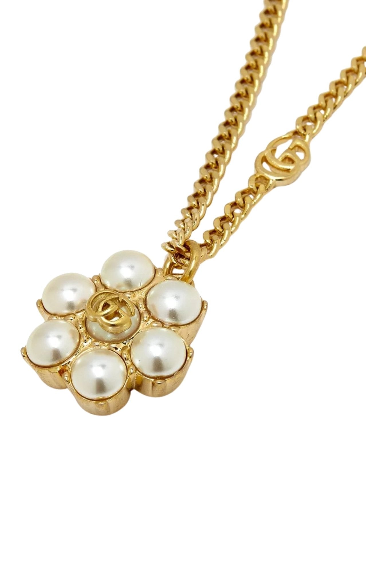 Close-up of Gucci pearl double G pendant necklace